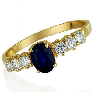 Anillo con Zafiro 4.8X3.5mm central 3 circonias 2mm a cada lateral oro 14k