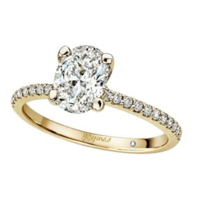 Anillo de compromiso con circonia ovalada y circonias a los laterales oro 10K