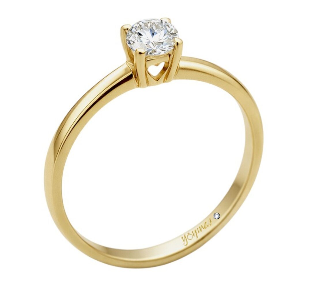 Anillo de promesa con circonia central y corazón calado en la montura oro 14K