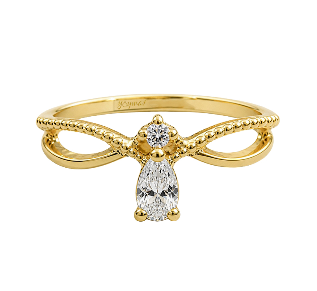 Anillo casual con circonia en forma de gota y circonia con laterales encontrados oro 10K